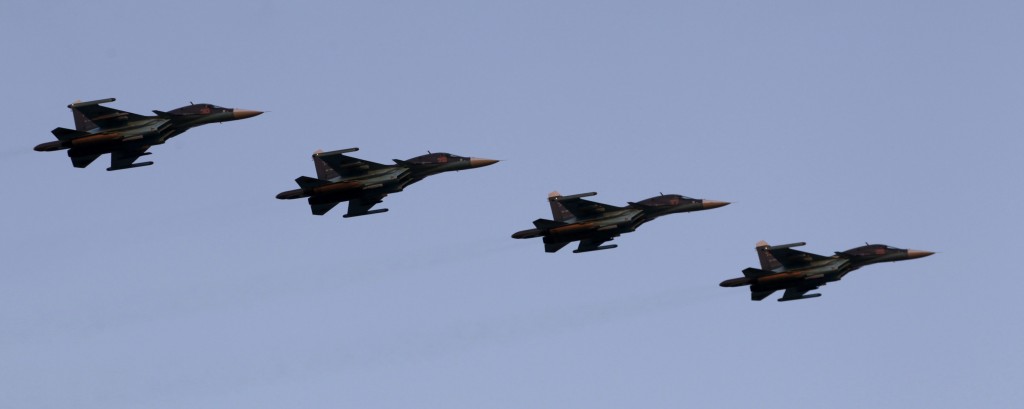 Russian Air Force Su-34 fighter-bombers take part in a military parade during celebrations marking Independence Day in Minsk