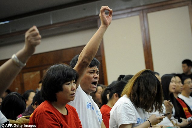 Anger: A Chinese relative of a passenger on missing flight at a meeting at Metro Park Hotel in Beijing